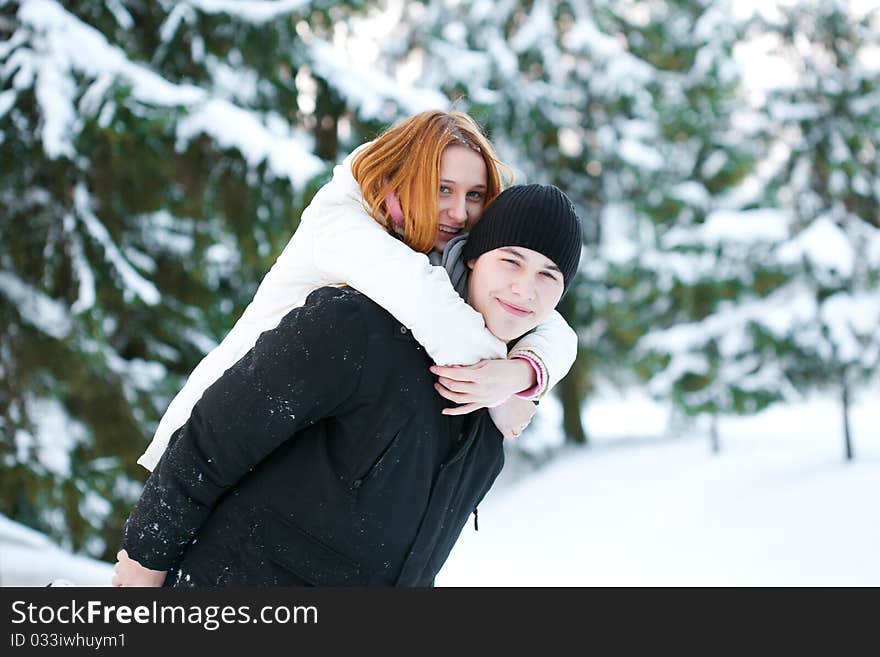 Guy and the girl enjoy winter walk