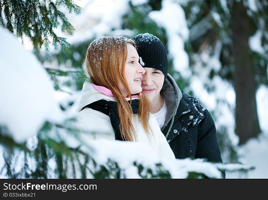 Guy and the girl enjoy winter walk