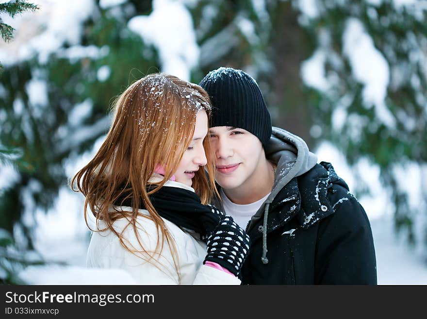 Guy and the girl enjoy winter walk