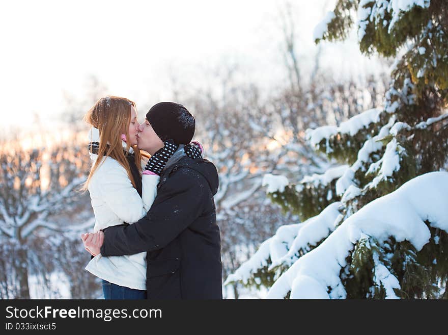 Guy and the girl enjoy winter walk