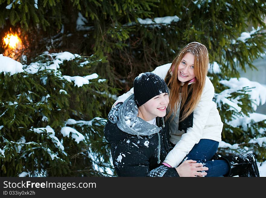 Young pair walks in wood, winter. Young pair walks in wood, winter