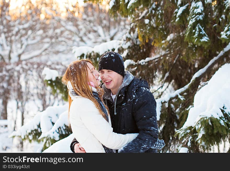 Guy and the girl enjoy winter walk