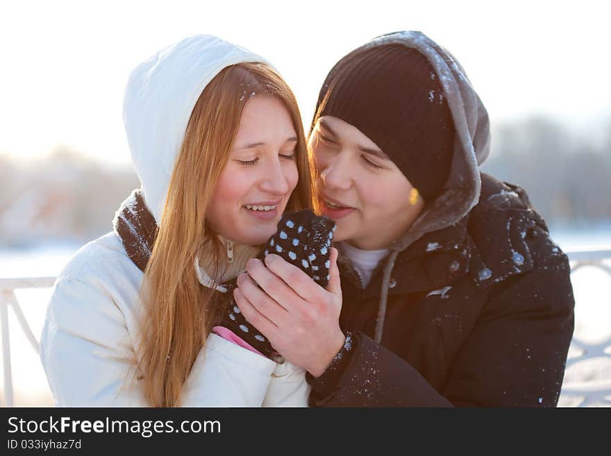 Young pair walks in wood, winter. Young pair walks in wood, winter