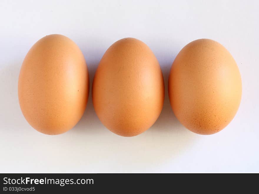 Three eggs close one another and horizontally aligned