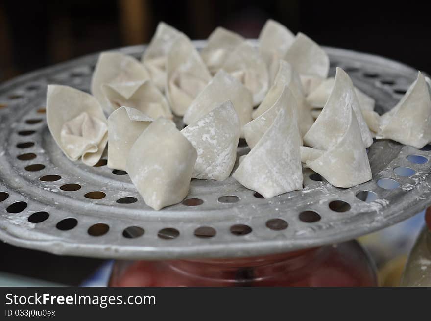 Chinese food called wan tan filled with meat, it's a popular snack in china.