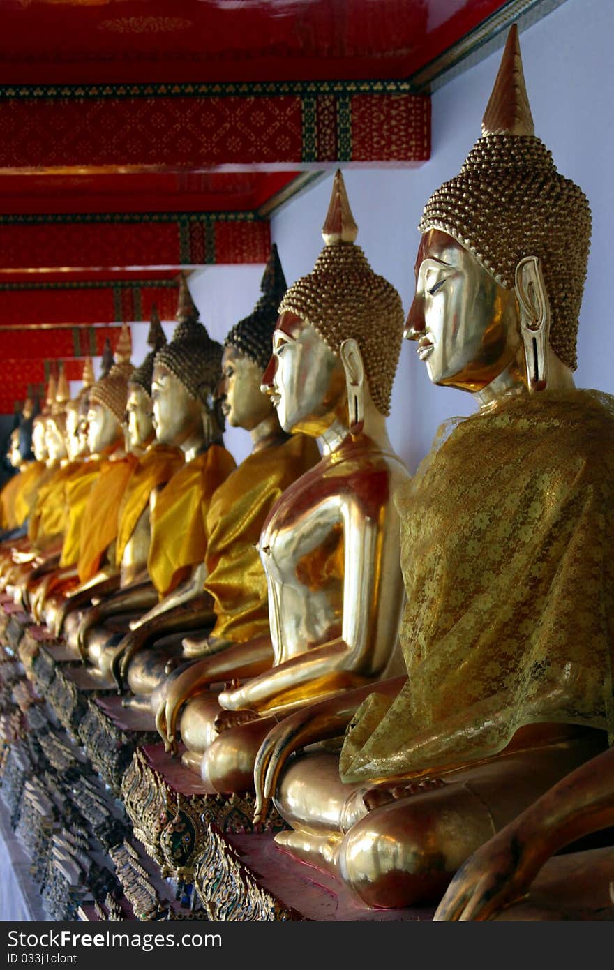 Row of buddhas in Wat Pho, Bangkok, Thailand