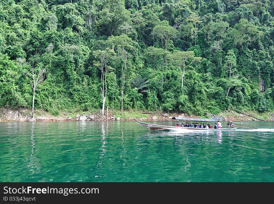 Long tailed boat cruise on emerald lake. Long tailed boat cruise on emerald lake.