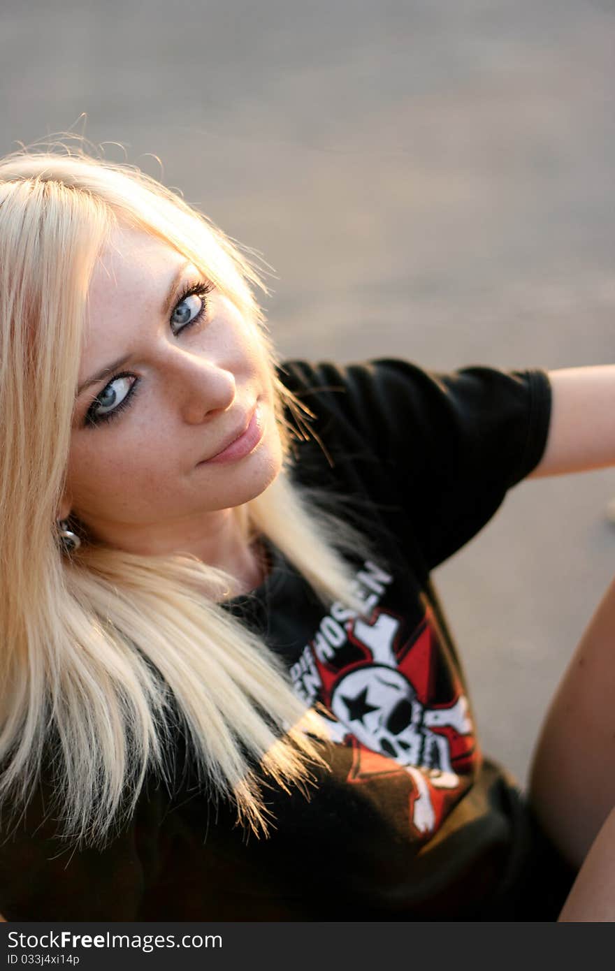 Young caucasian teen with skate on the street