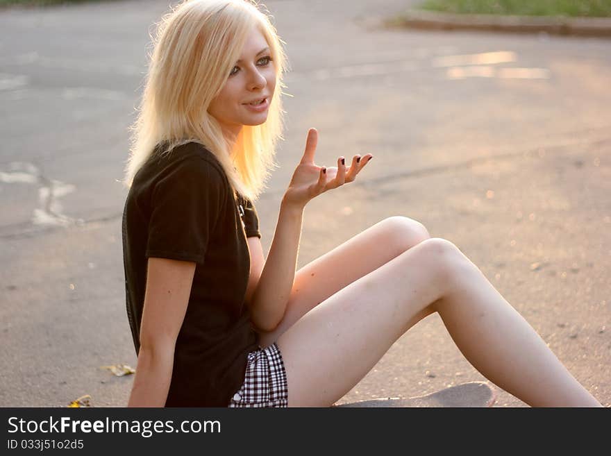 Young caucasian teen with skate on the street