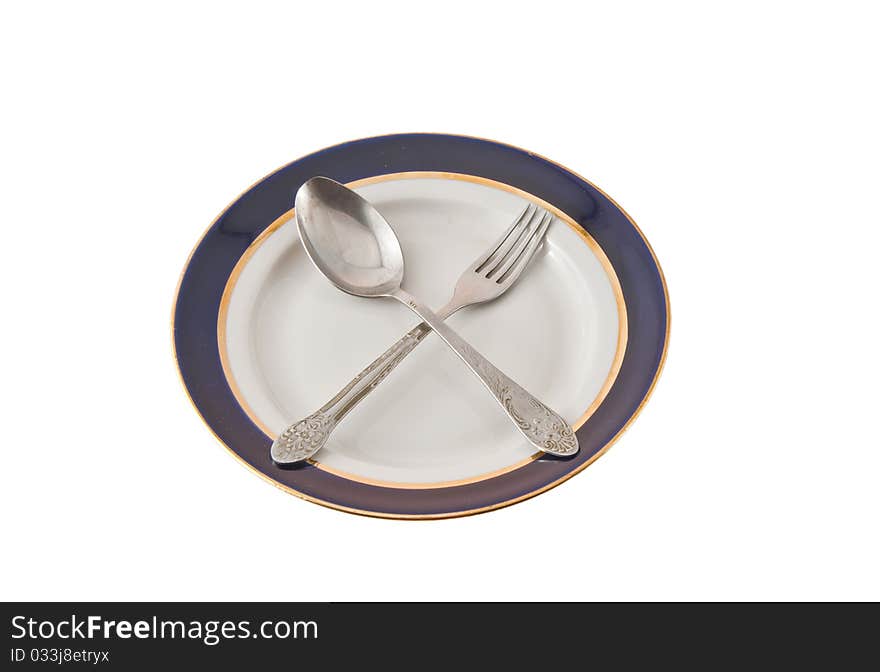 Fork And Spoon Crossed On Plate