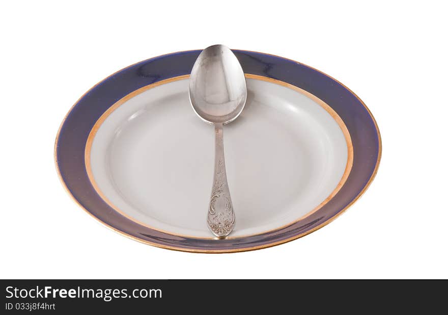 Fork And Spoon Crossed On Plate