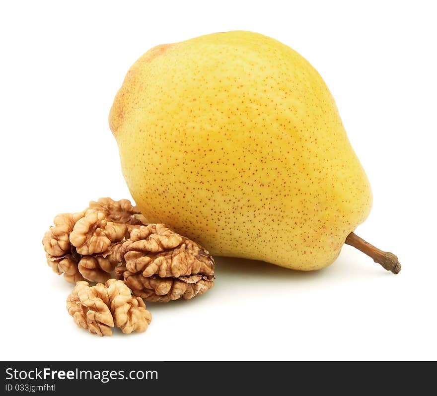 Pear and walnut on a white background