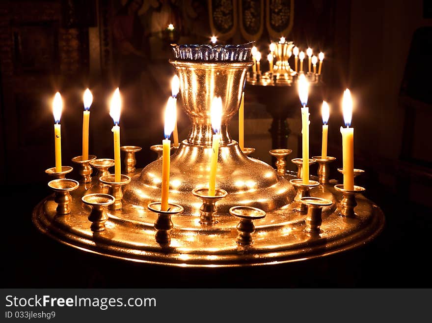 Candles and a lamp burning in the church.