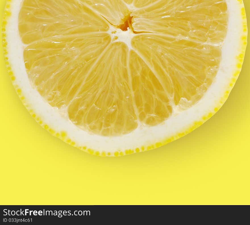 Lemon slice on yellow background