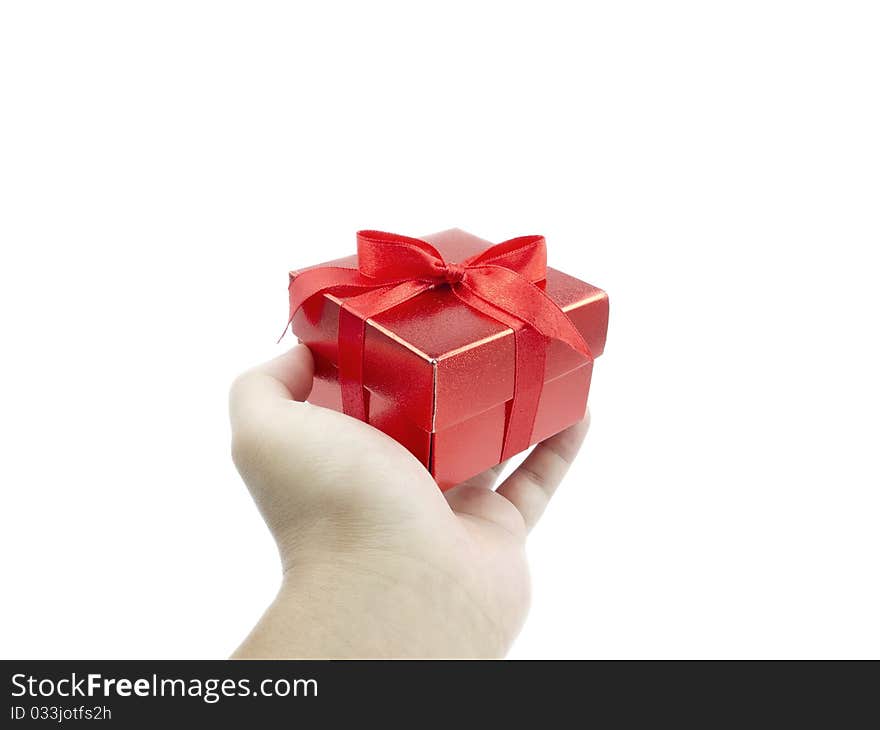 Red gift and human hand on white background. Red gift and human hand on white background