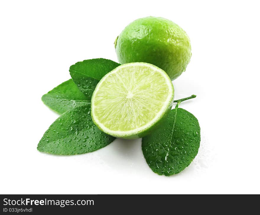 Green lemons with leaves