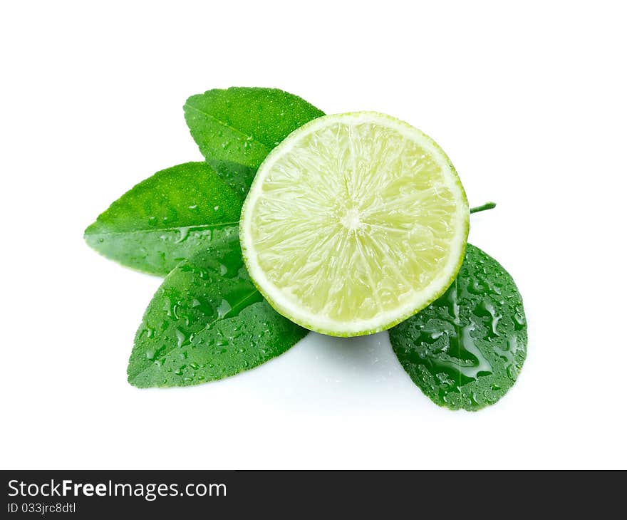 Green lemon with leaves on white background. Green lemon with leaves on white background