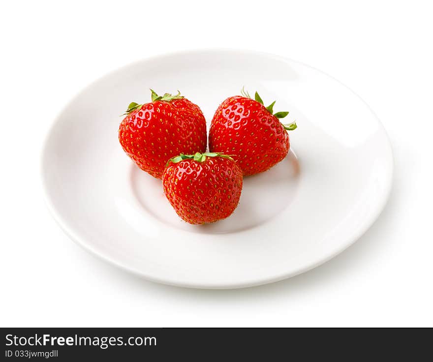 Three Strawberries On The Plate