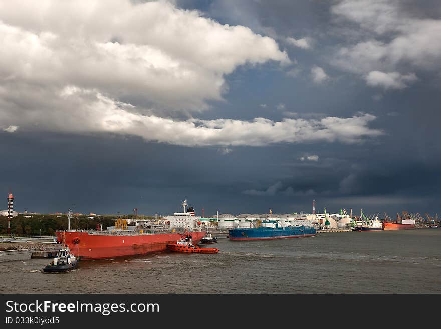 Harbor with big ships and stormy sky. Harbor with big ships and stormy sky