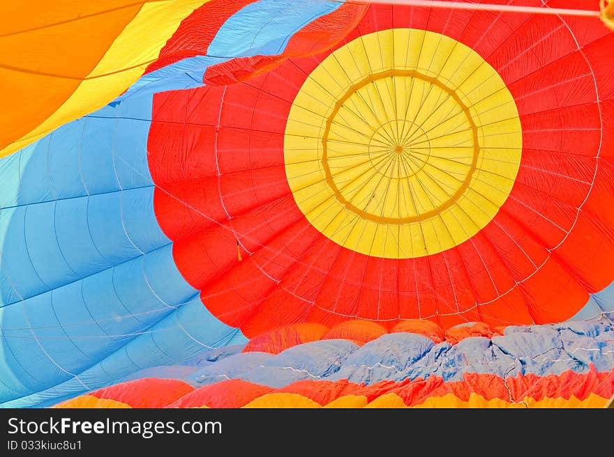 Inside of blue red and yellow hot air balloon.