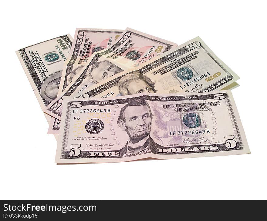 Various denominations of US currency on white background. Various denominations of US currency on white background