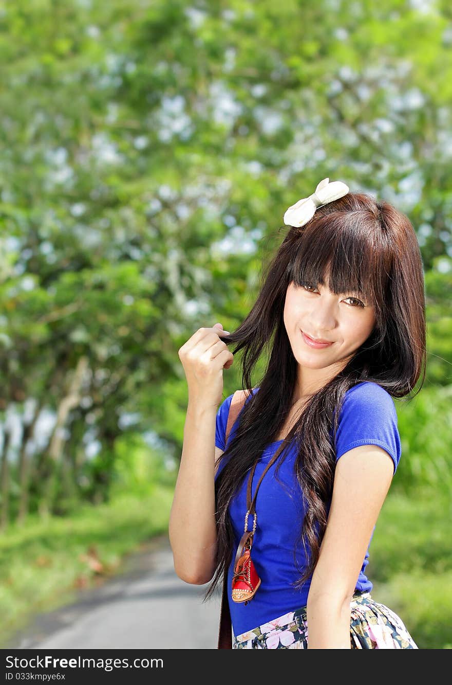 Portrait of young girl smiling and playing with her hair. Portrait of young girl smiling and playing with her hair