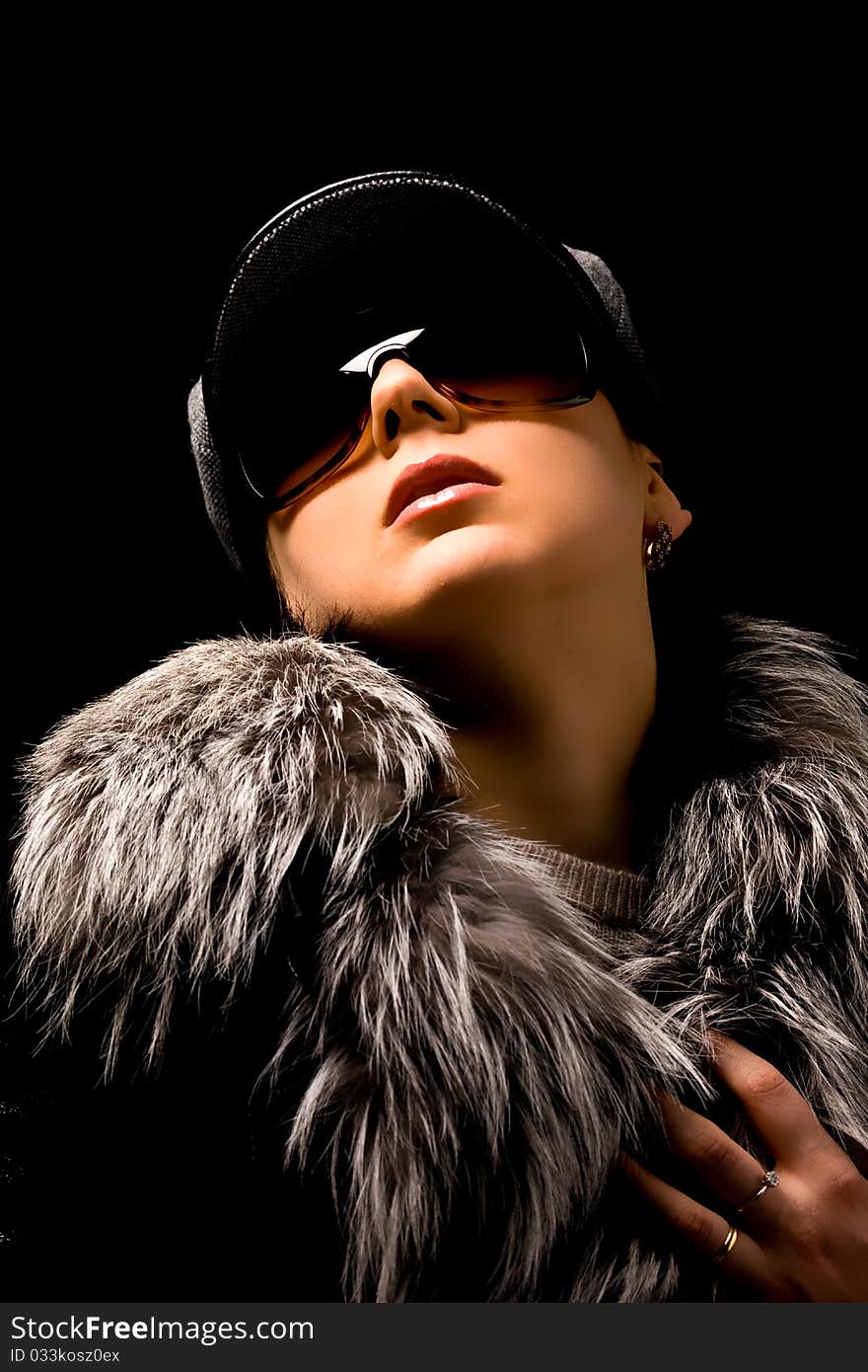 Sexy woman with furr and sunglasses