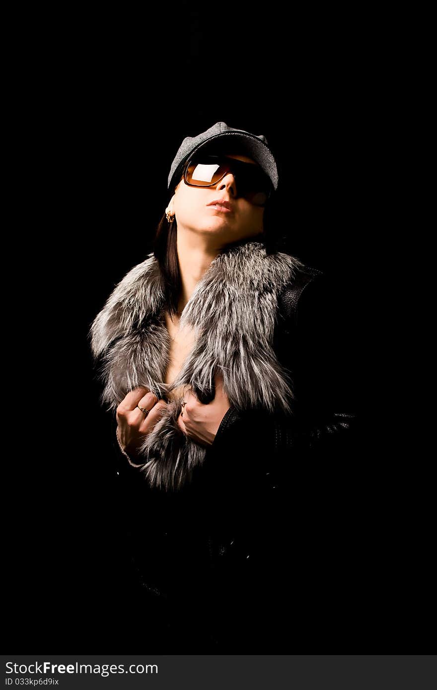 Sexy woman with furr and sunglasses