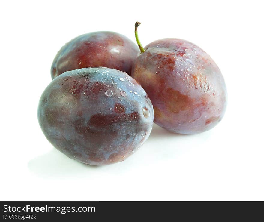 Ripe juicy plum with on a white background. Ripe juicy plum with on a white background