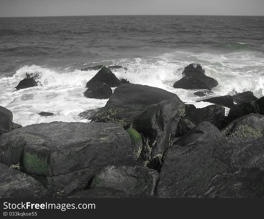 Waves crashing on a rocky beach, Asbury Park, NJ. Waves crashing on a rocky beach, Asbury Park, NJ