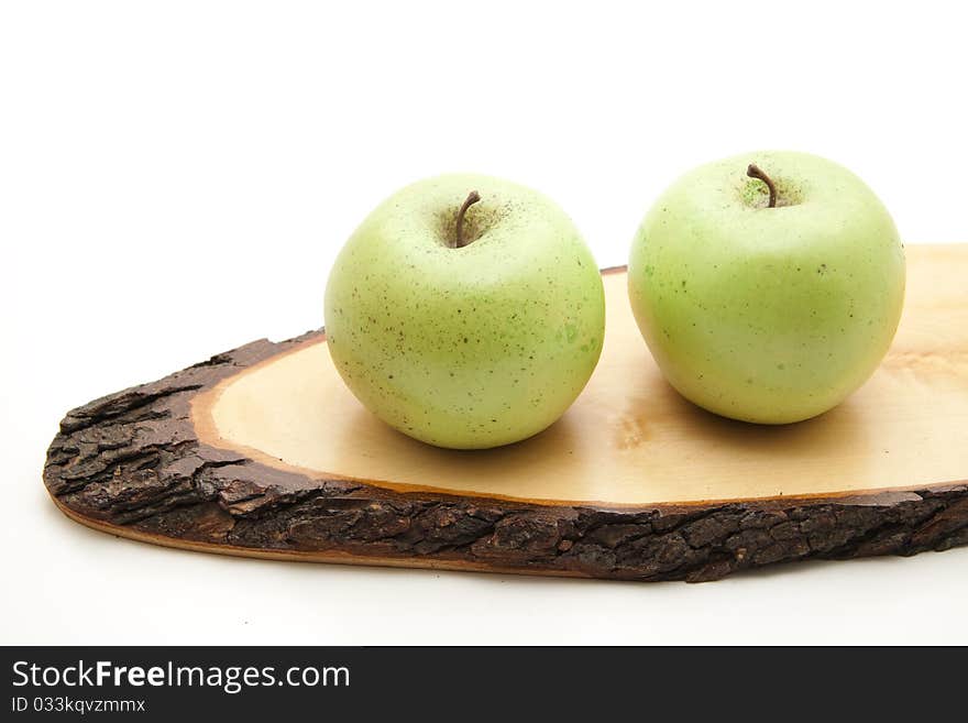 Apples on wood with bark