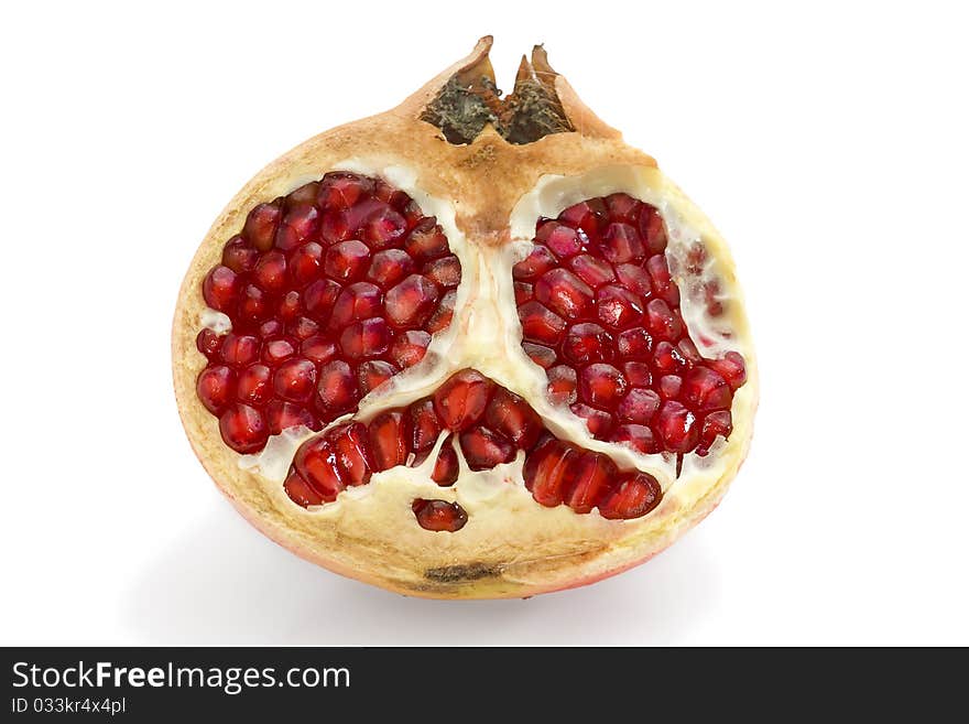 Falling pomegranate slices. Isolated on a white background