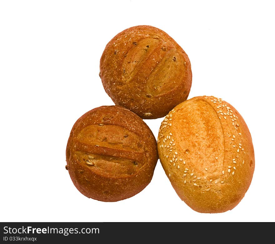 Wheat rolls with sesame seeds isolated on white