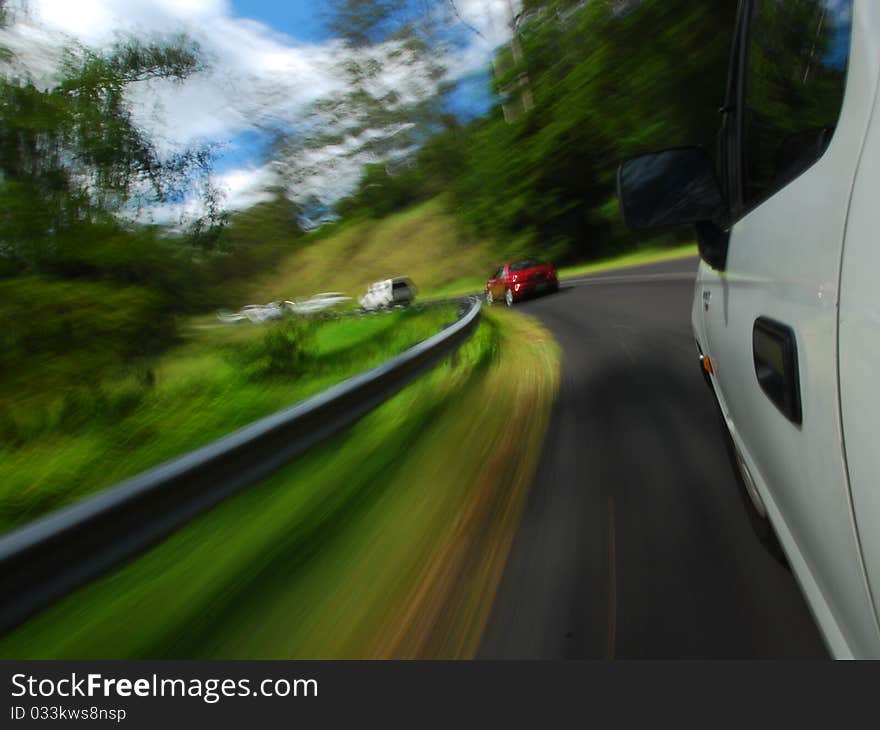 A convey of vehicles travelling up Mt. Tamborine in Queenslands hinterland, Australia. A convey of vehicles travelling up Mt. Tamborine in Queenslands hinterland, Australia.