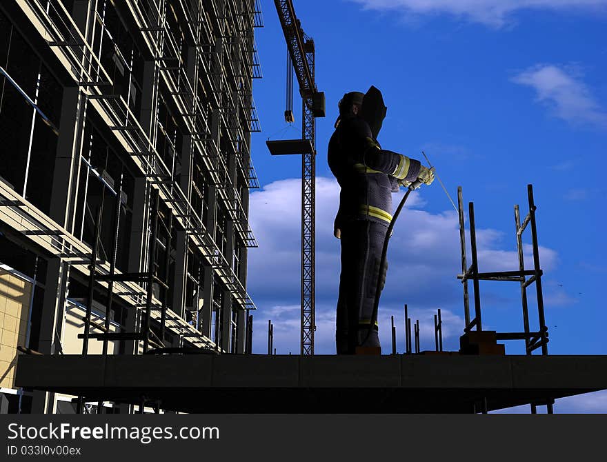 Silhouette of the worker on a background of the sky. Silhouette of the worker on a background of the sky