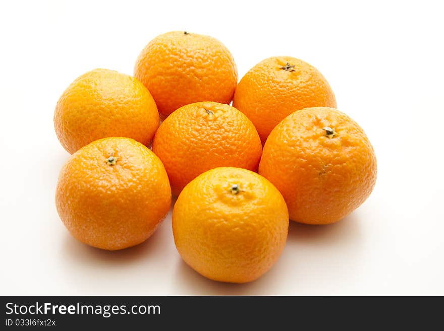 Tangerines with shell onto white background