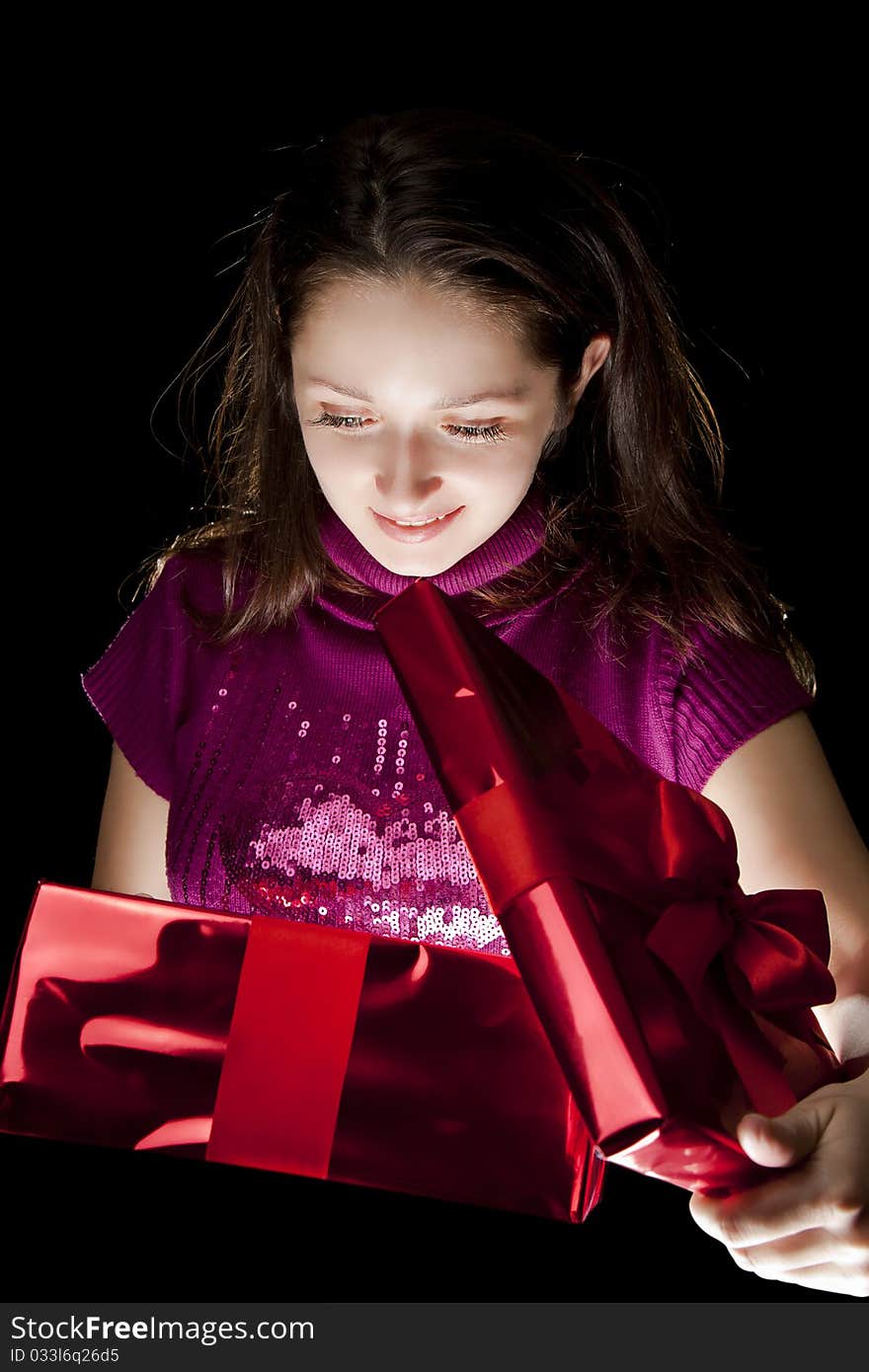 Young happy girl open gift box. Young happy girl open gift box