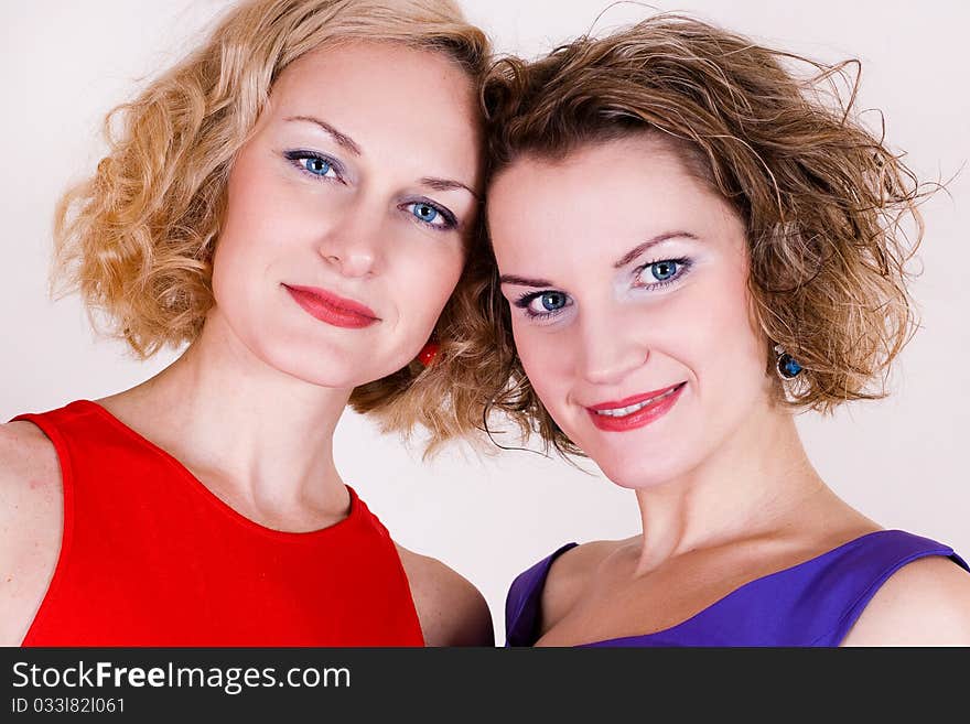 Portrait of beauty sisters with blue eyes