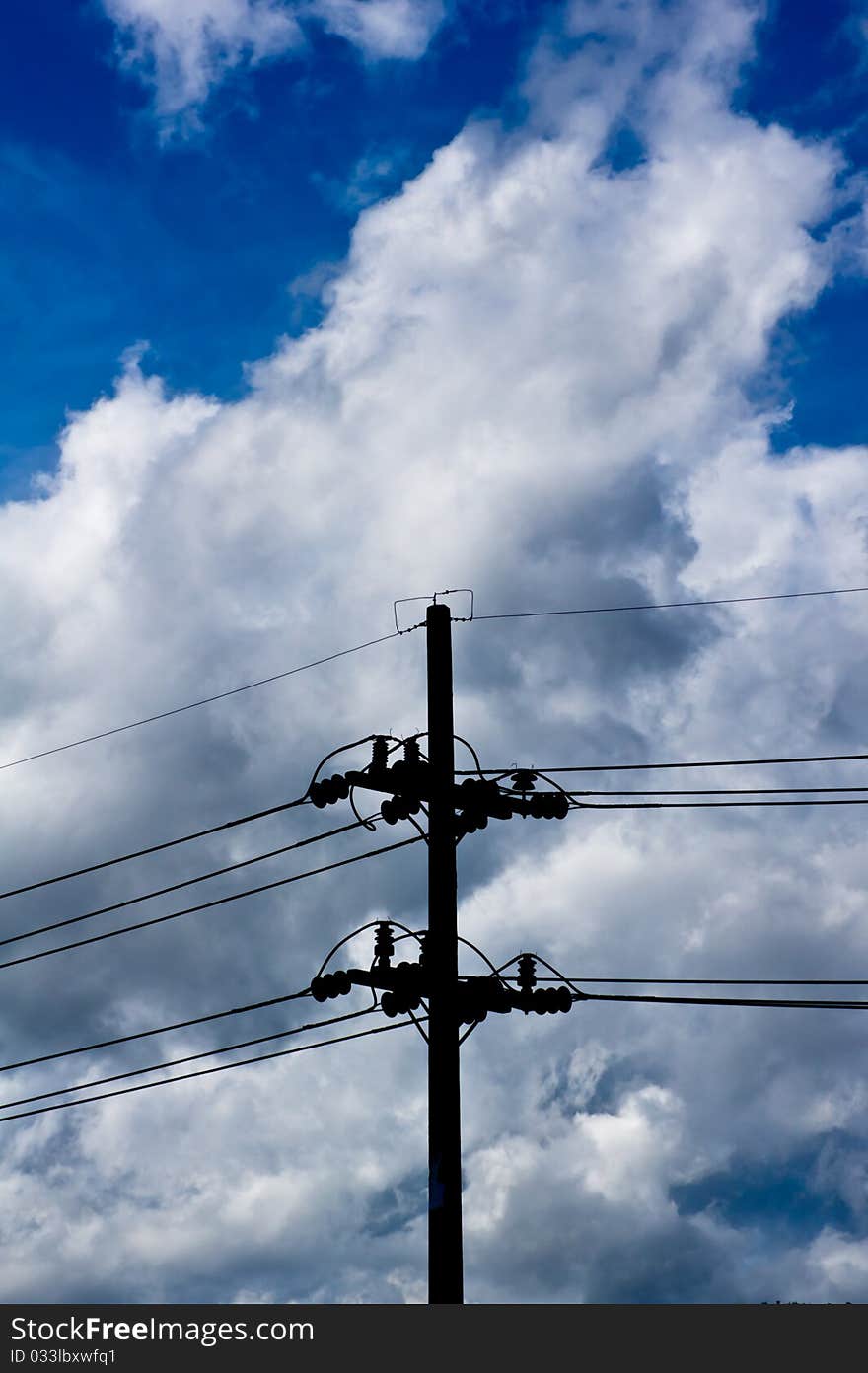 Silhouette light poles on the blue sky background