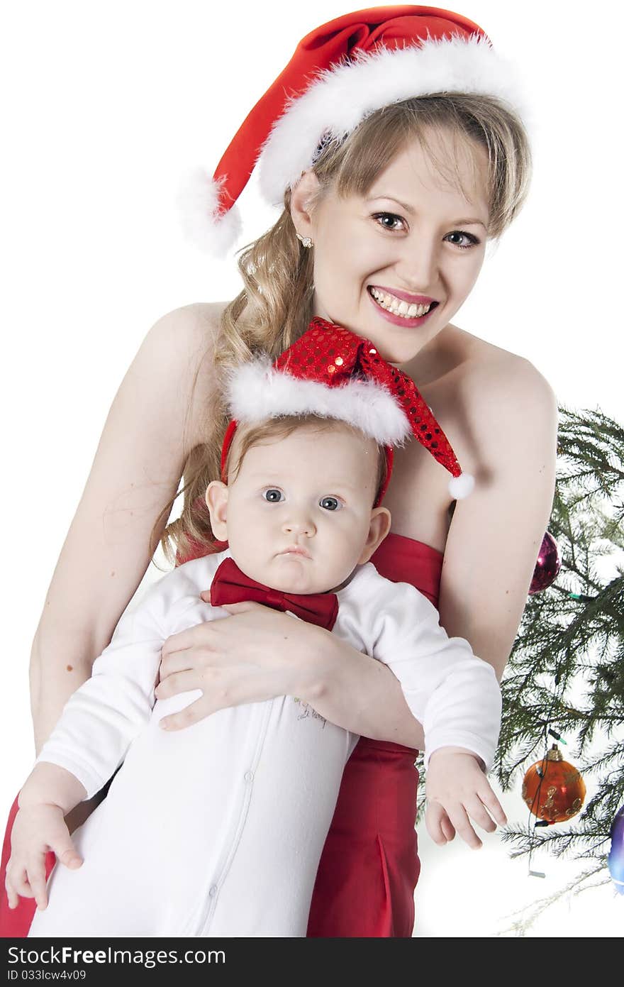 Nice woman and baby in red christmas hats