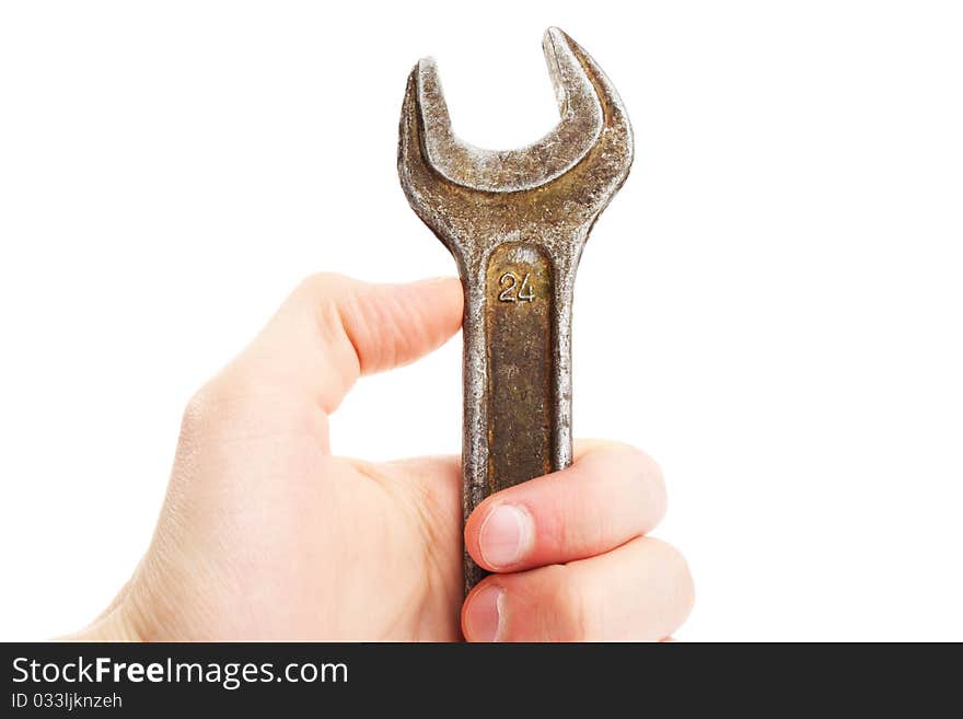 Hand holding spanner; wrench. Repair