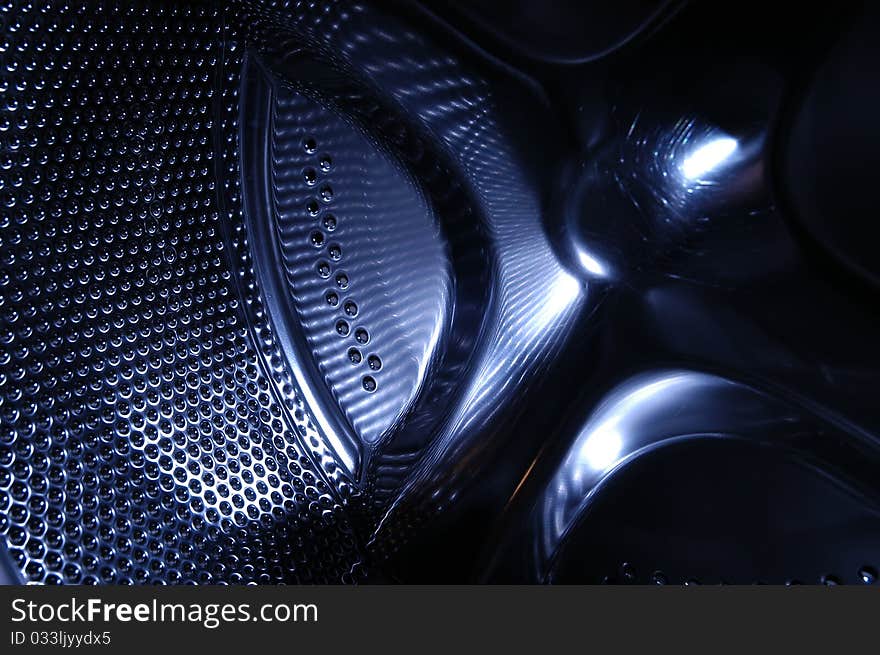 Holes on the stainless steel wash drum of a washing machine. Holes on the stainless steel wash drum of a washing machine