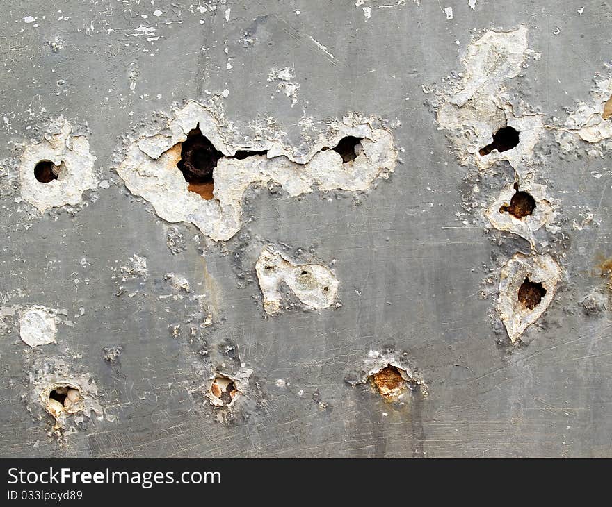 Grey holed surface closeup background. Grey holed surface closeup background.