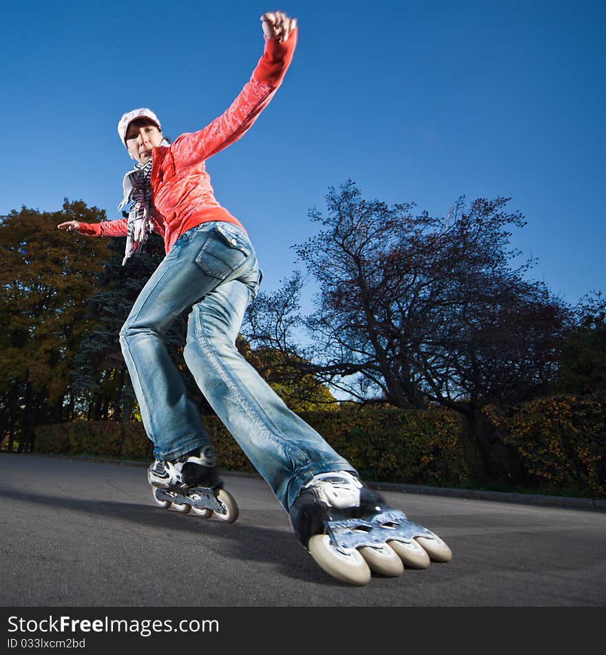 Wide-angle shot of a sliding rollerskater - motion blur on person. Wide-angle shot of a sliding rollerskater - motion blur on person