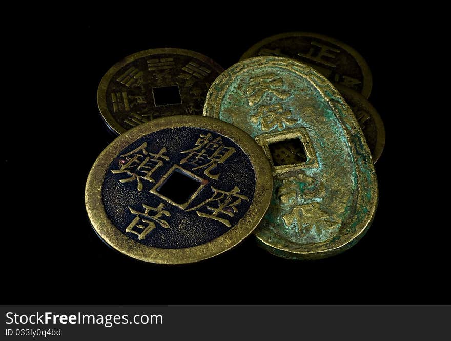 Chinese coins on black