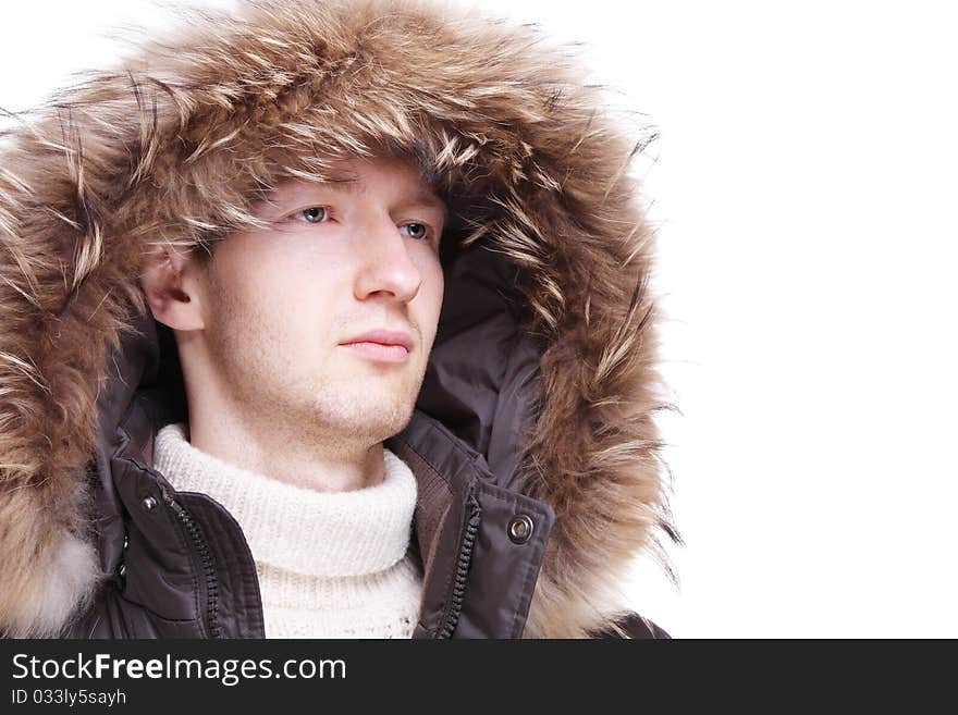 Young man wearing winter jacket isolated over white