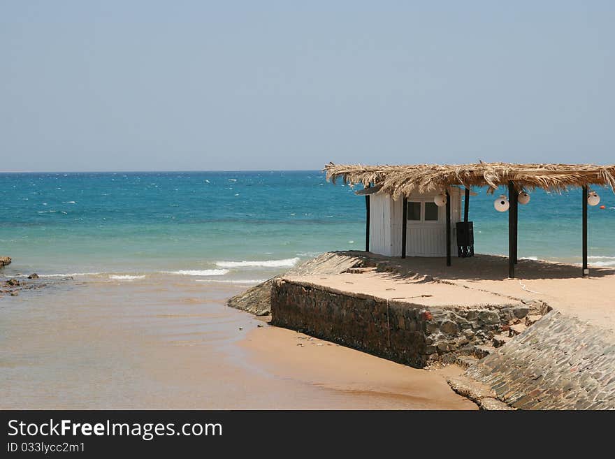 Small house on seacoast in a sunny day