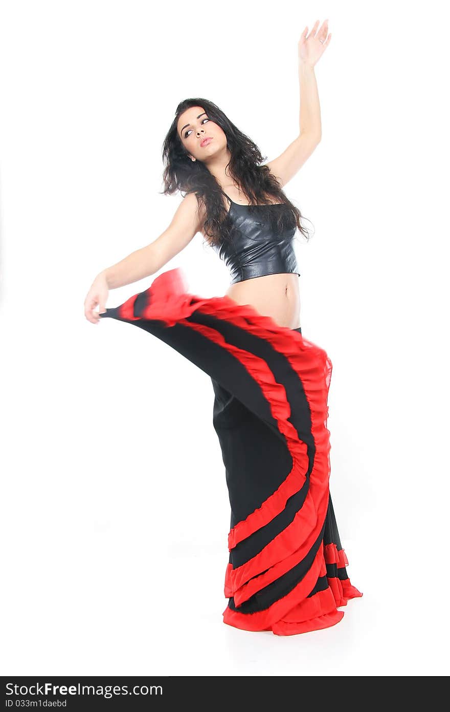 Studio shot of young woman dancing latino over white