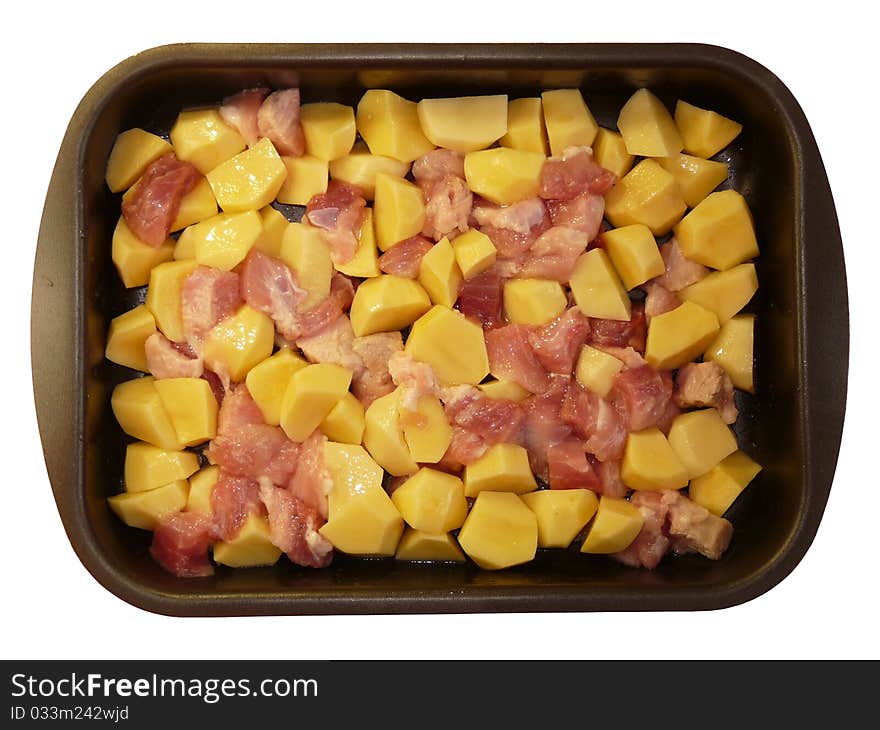 Meat and potatoes in trays, isolated on a white background