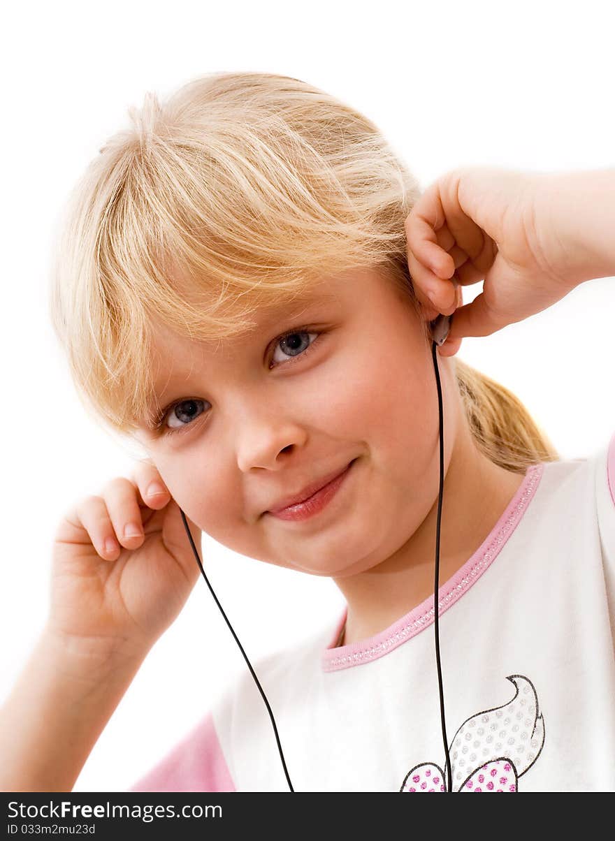 Little girl in headphones, white background